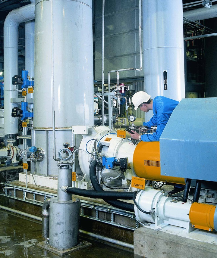 man_investigating_pump_in_factory_1500x1785